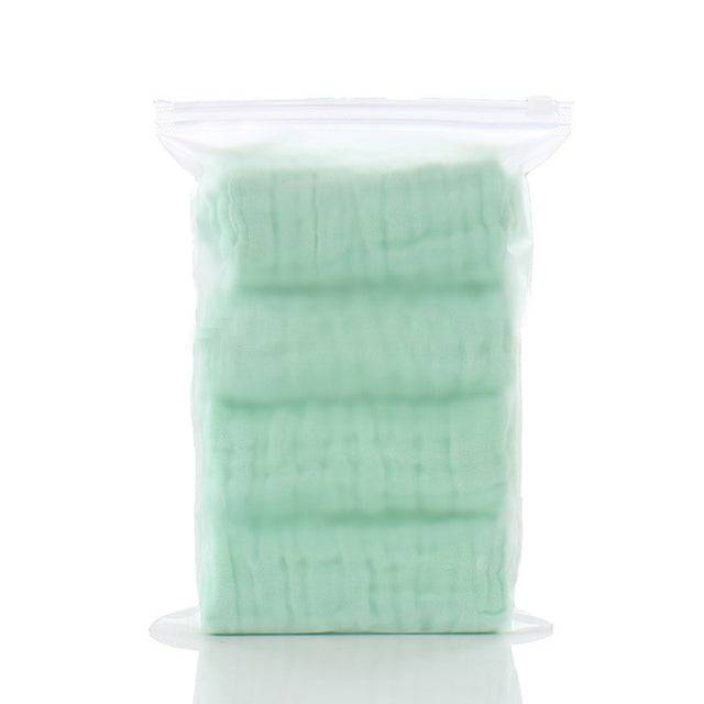 a spool of green wax on a white background