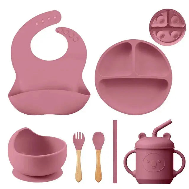 a set of baby feeding utensils and accessories