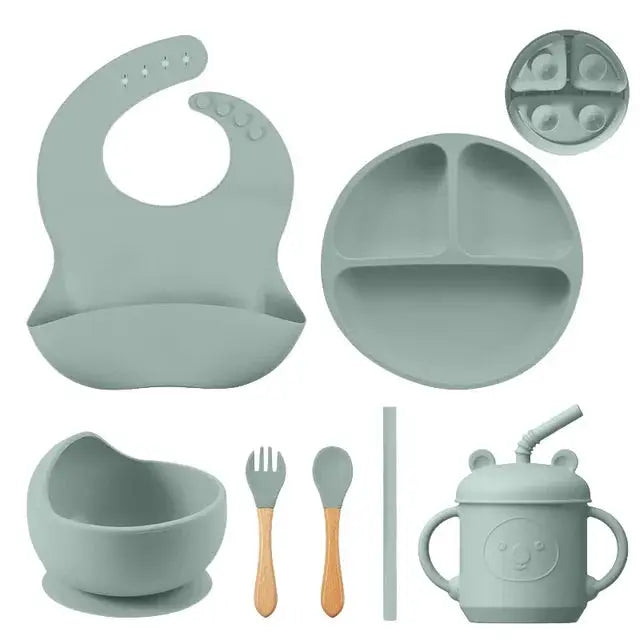 a set of baby feeding utensils and accessories