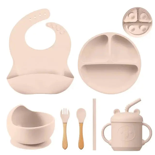 a set of baby feeding utensils and accessories