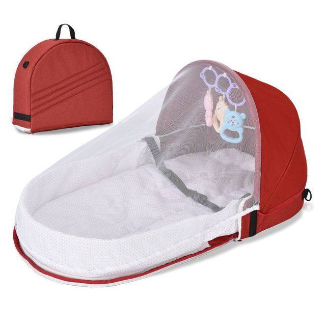 a red and white baby crib with a red backpack