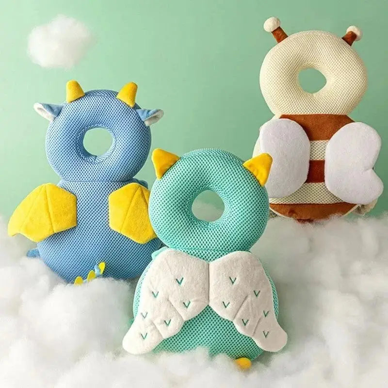 a group of three stuffed animals sitting on top of a cloud