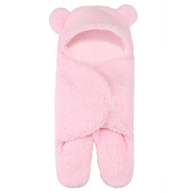 a pink bear mitt is shown on a white background