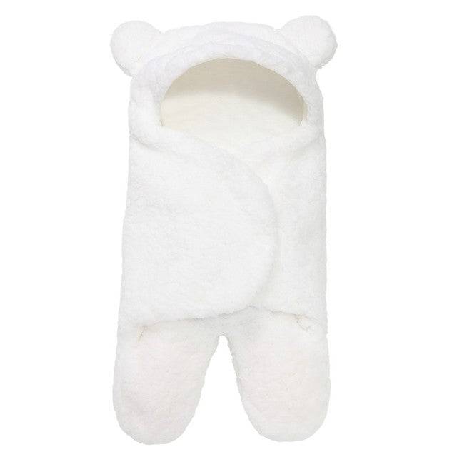 a white teddy bear sleeping bag