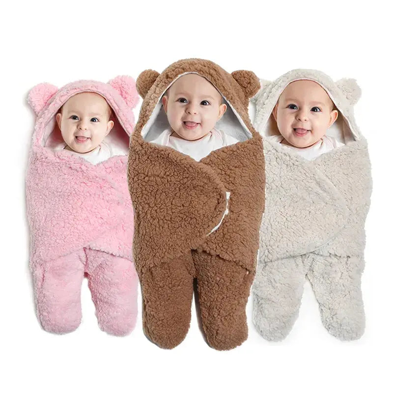 three babies wearing animal onesuits on a white background