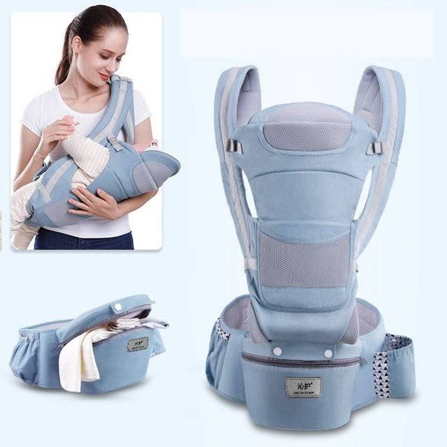 a woman holding a baby in a baby carrier