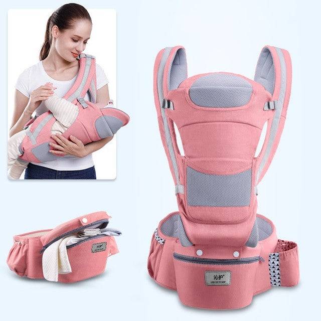 a woman holding a baby in a pink carrier