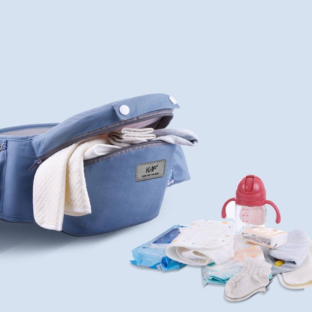 a blue bag filled with diapers and a baby bottle