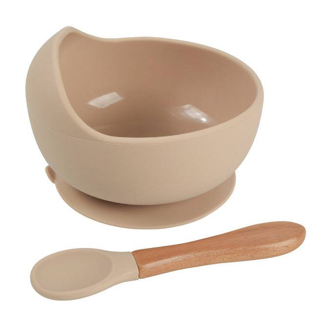 a bowl with a wooden spoon next to it