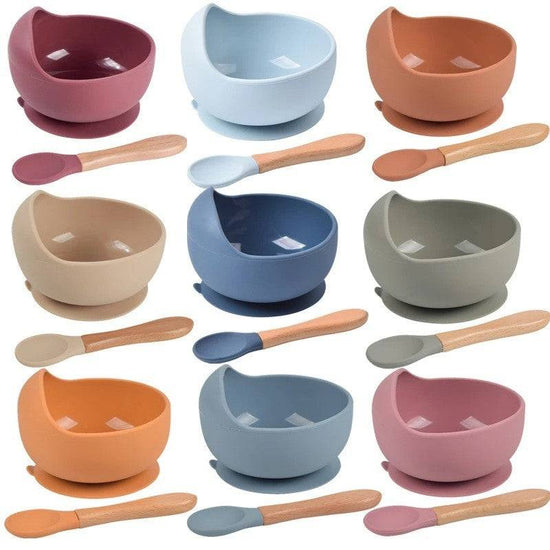 a bunch of bowls with spoons in them