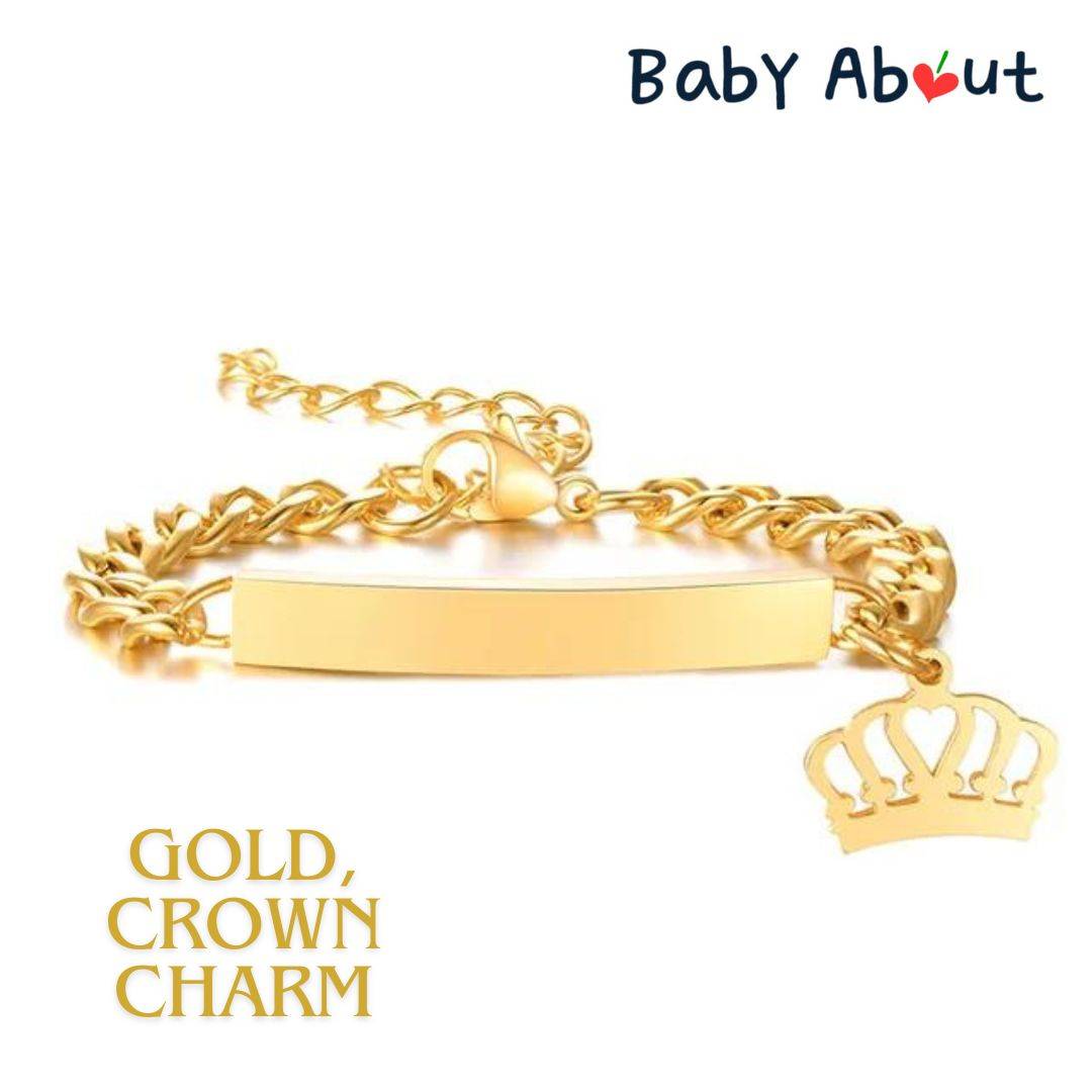 a gold chain bracelet with a crown charm