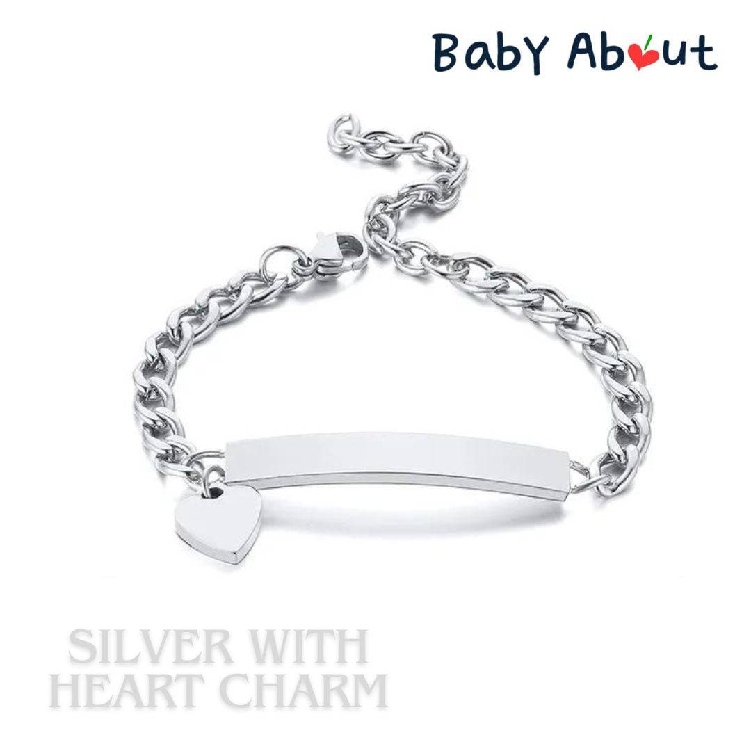 a silver bracelet with a heart charm on it