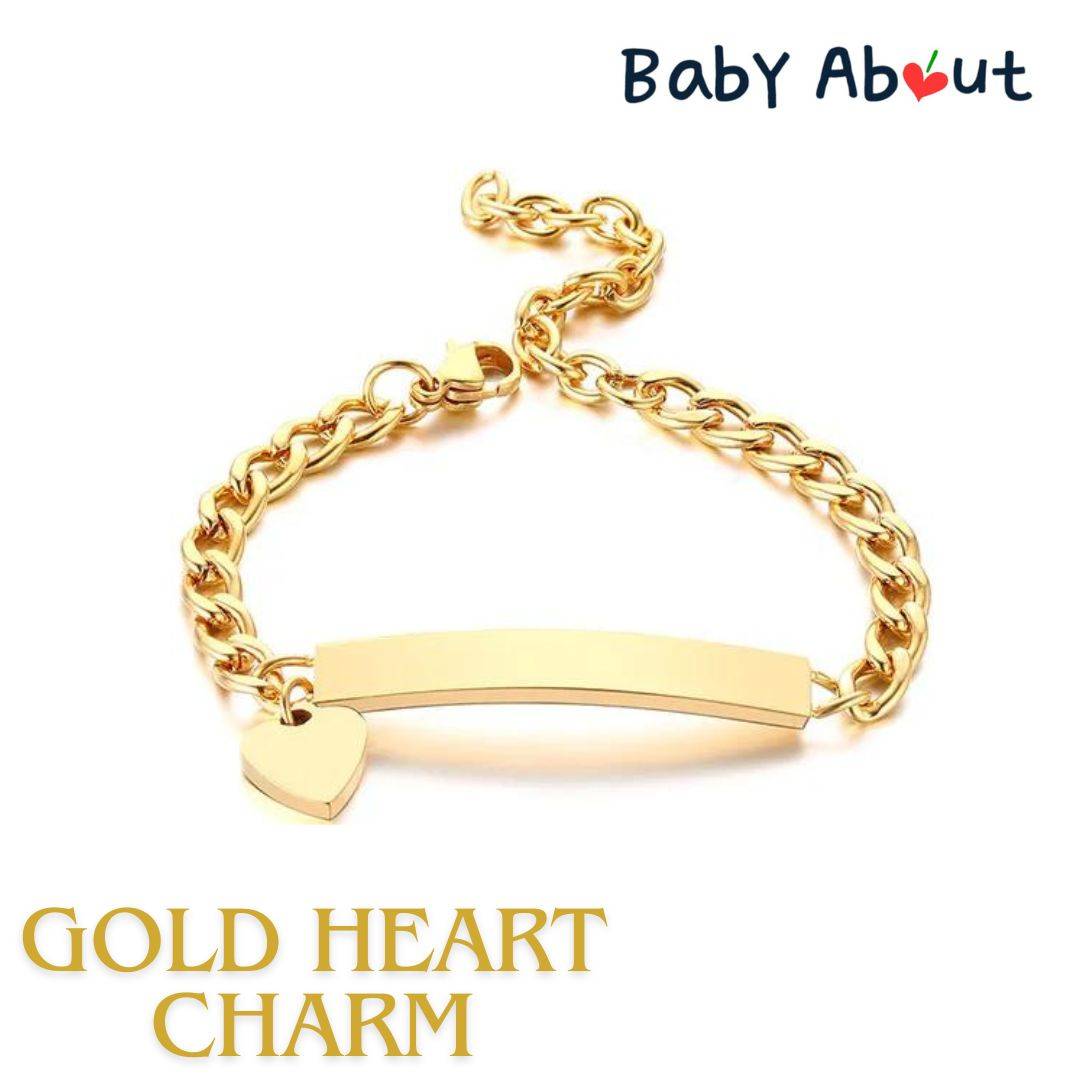 a gold bracelet with a heart charm on it