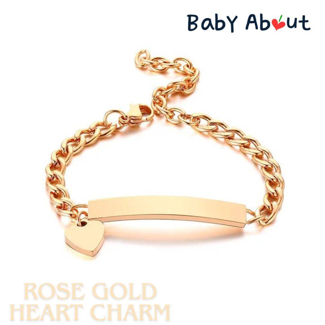 a gold bracelet with a heart charm on it