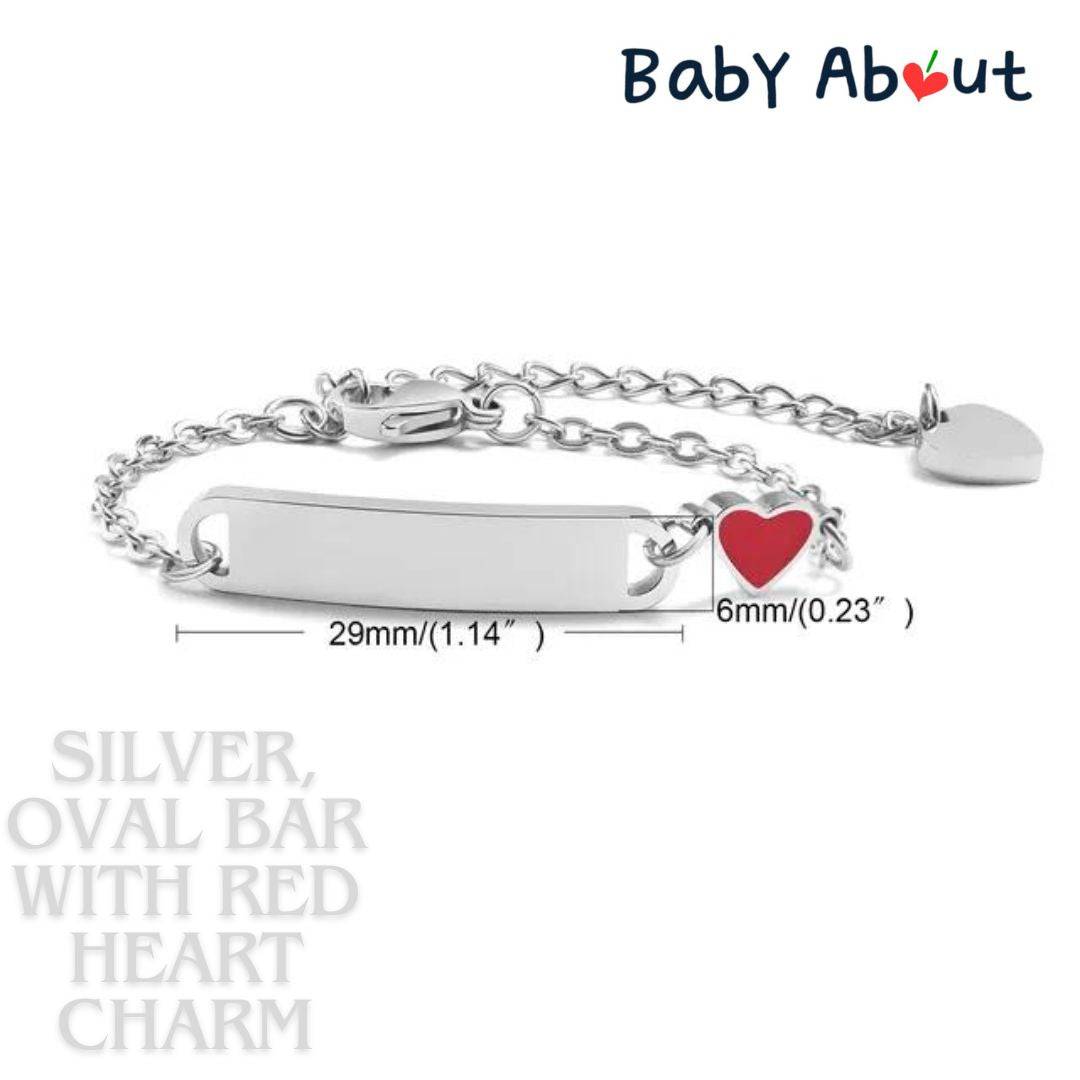 a silver bracelet with a red heart charm