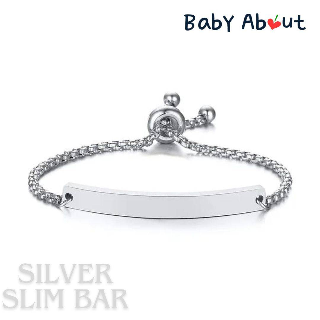 a silver bracelet with a name tag on it