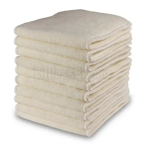 a stack of white towels stacked on top of each other