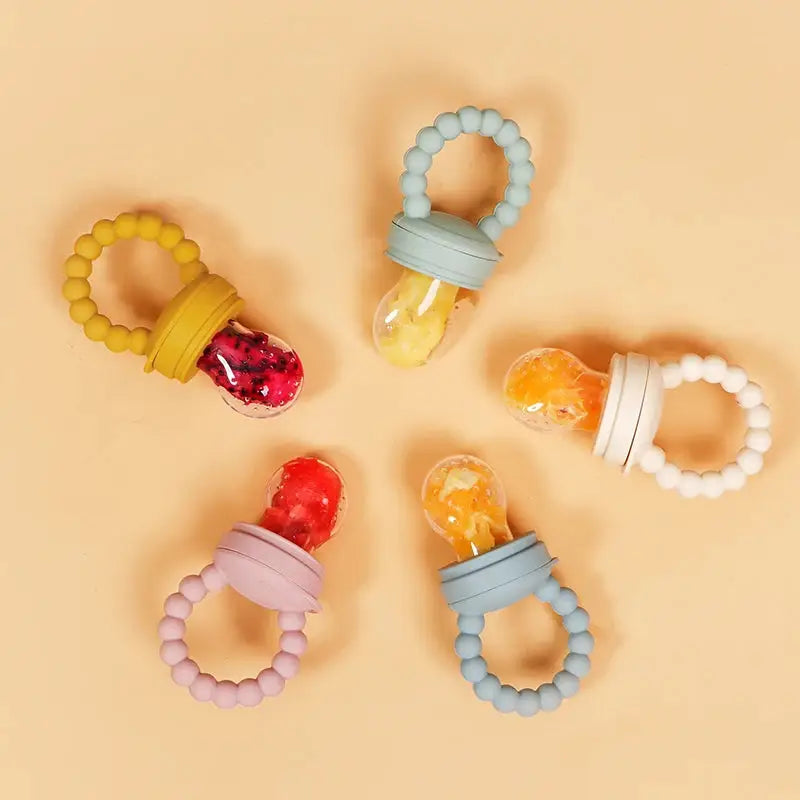 a group of four pacifiers sitting on top of a table