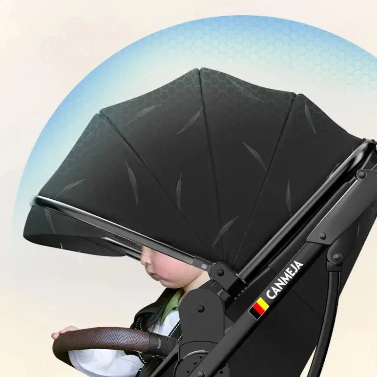 a baby in a stroller with a black umbrella