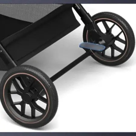 a black stroller with wheels on a white background