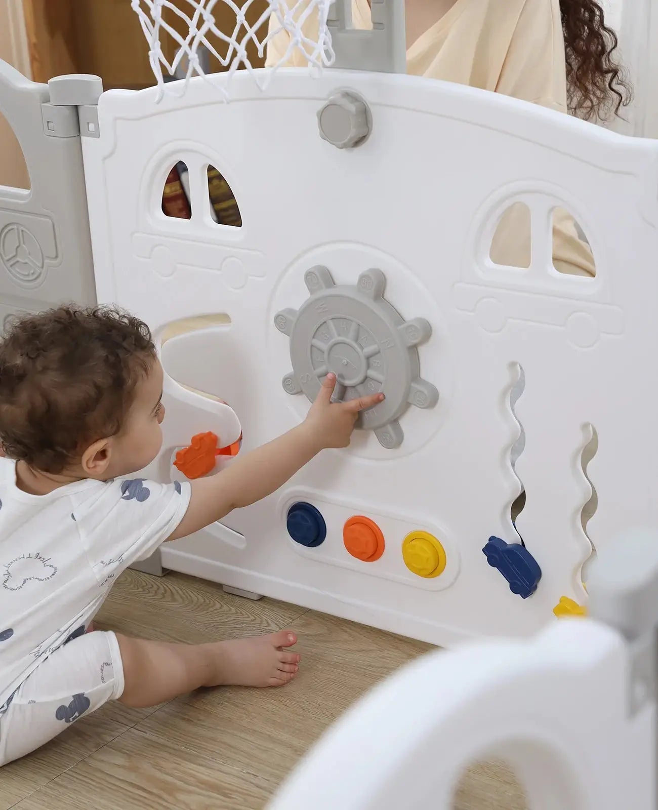 a young child playing with a play house